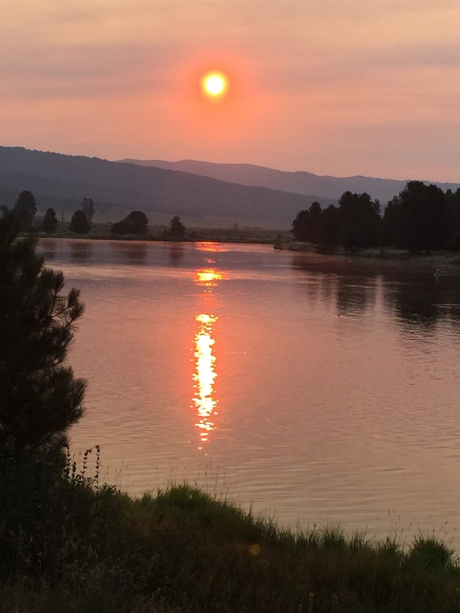 Sunrise over river by a bridge on the way to work. 