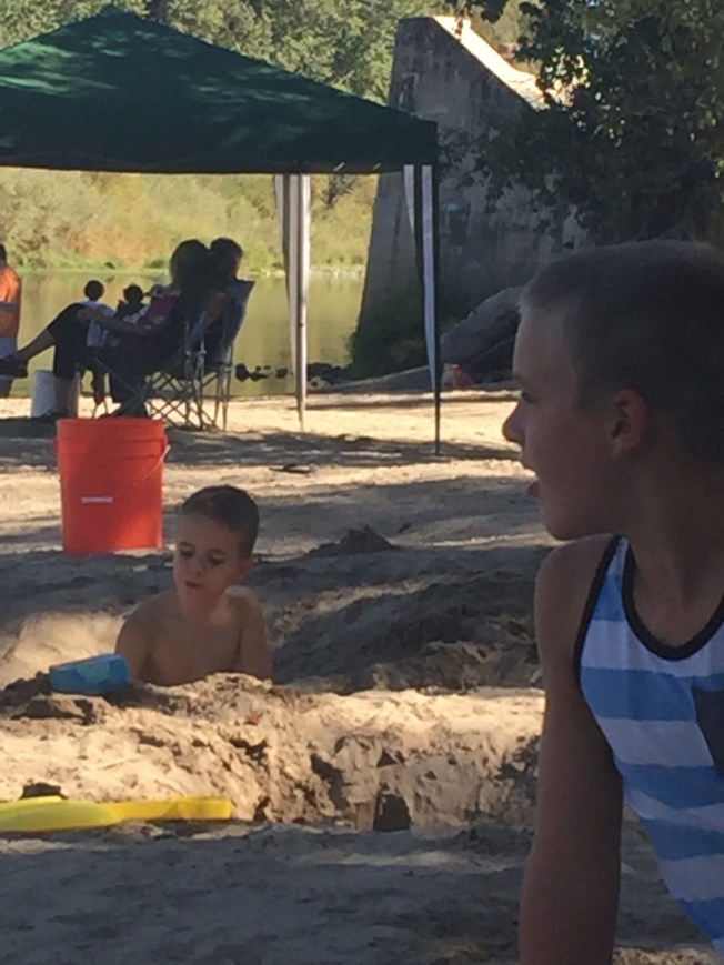 When we got to the riverside beach, Zeke took a look around and said, "We've got a lot of work to do!"  Then all three proceeded to dig holes.  They play together so well!