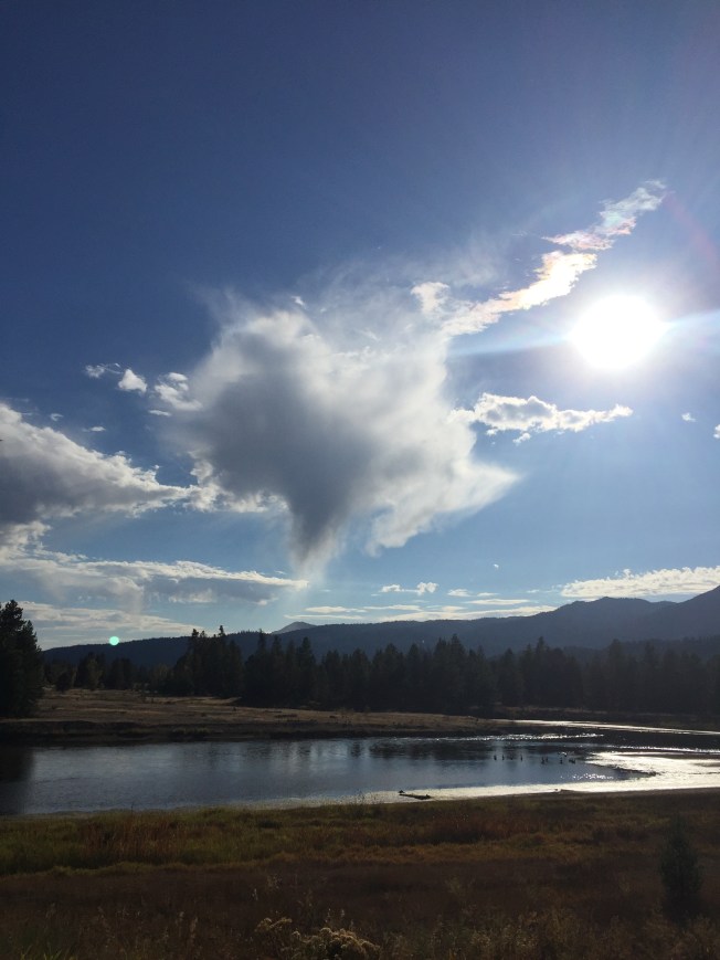 Heart shaped cloud with sun